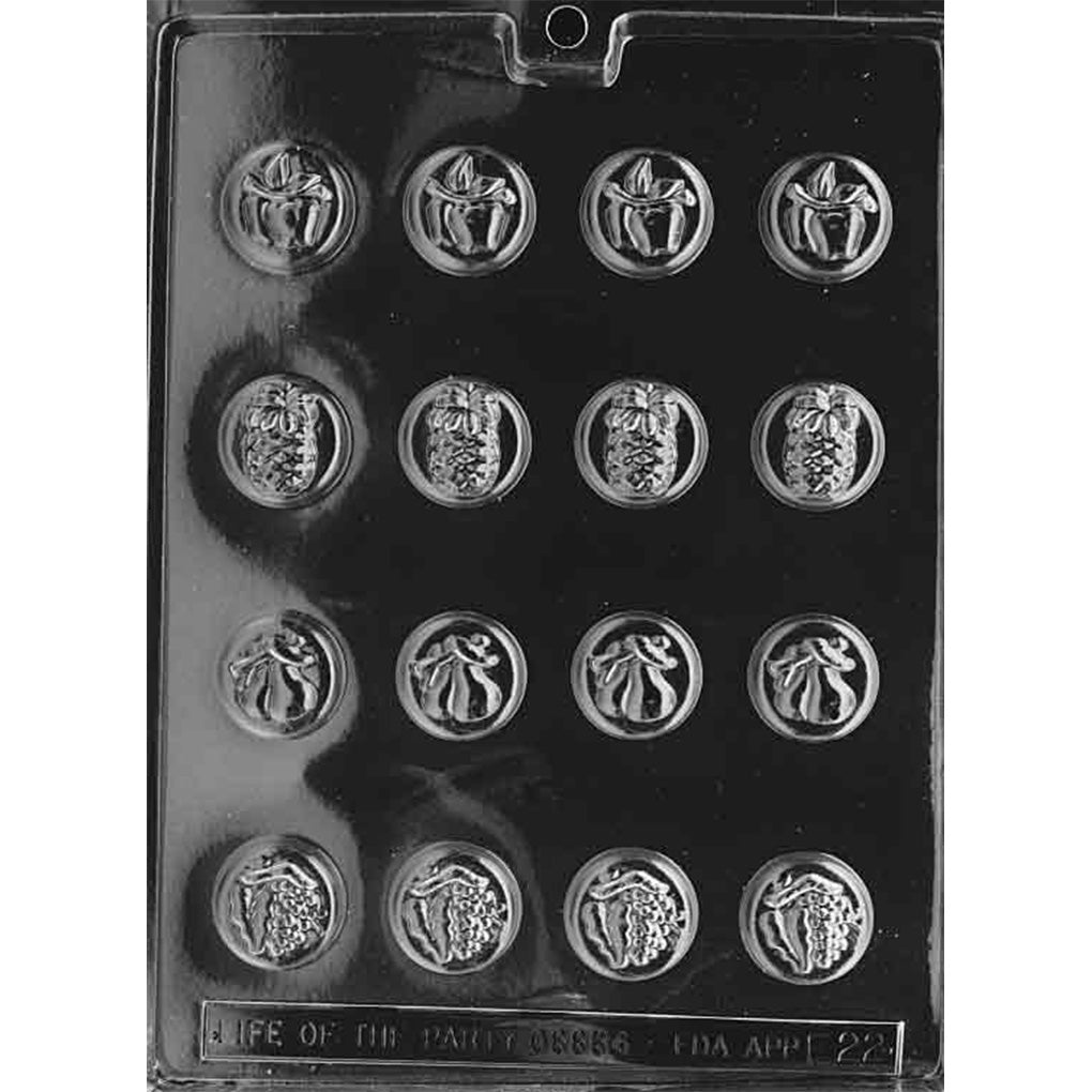 Clear Assorted Fruit Mints Chocolate Mold photographed against a black background with 16 small round cavities featuring apple, pineapple, pear, and grape designs.