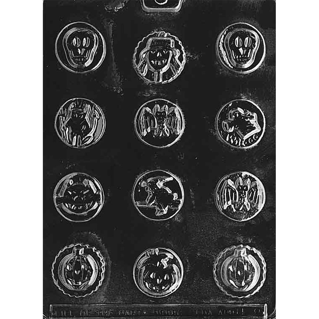 Clear plastic chocolate mold with multiple small round cavities, each featuring a different Halloween design such as skulls, bats, ghosts, devils, witches, and jack-o’-lanterns.