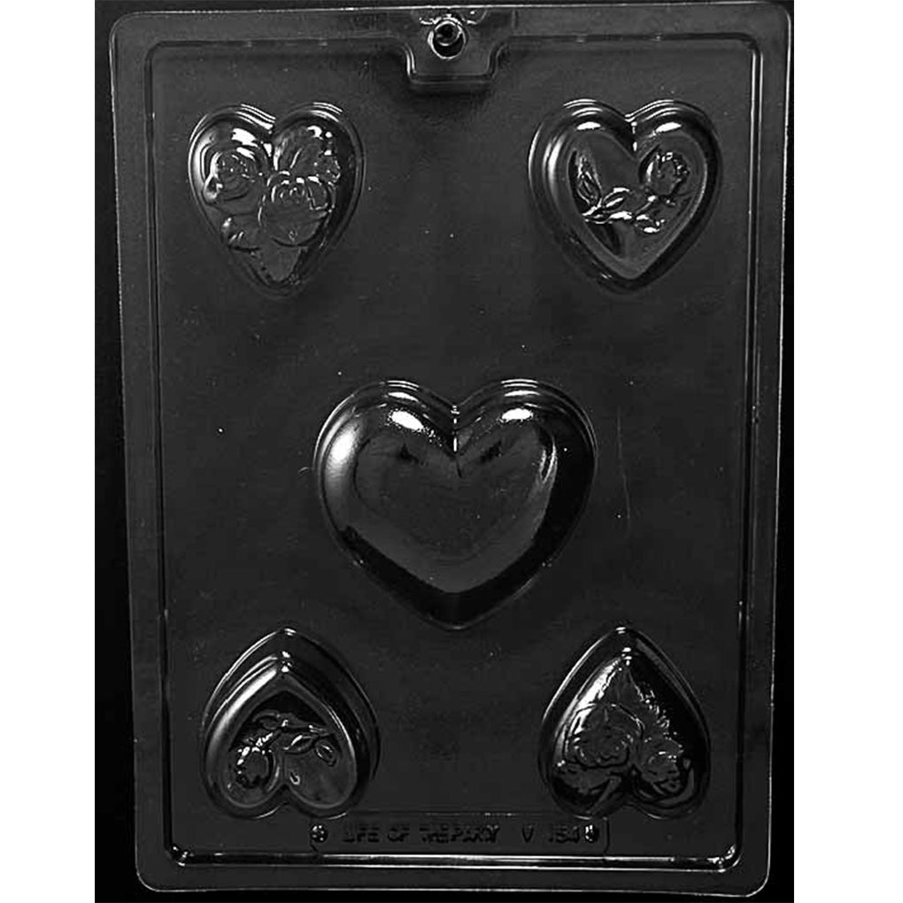 Clear plastic heart bar assortment chocolate mold with five heart-shaped cavities, shown against a black background.