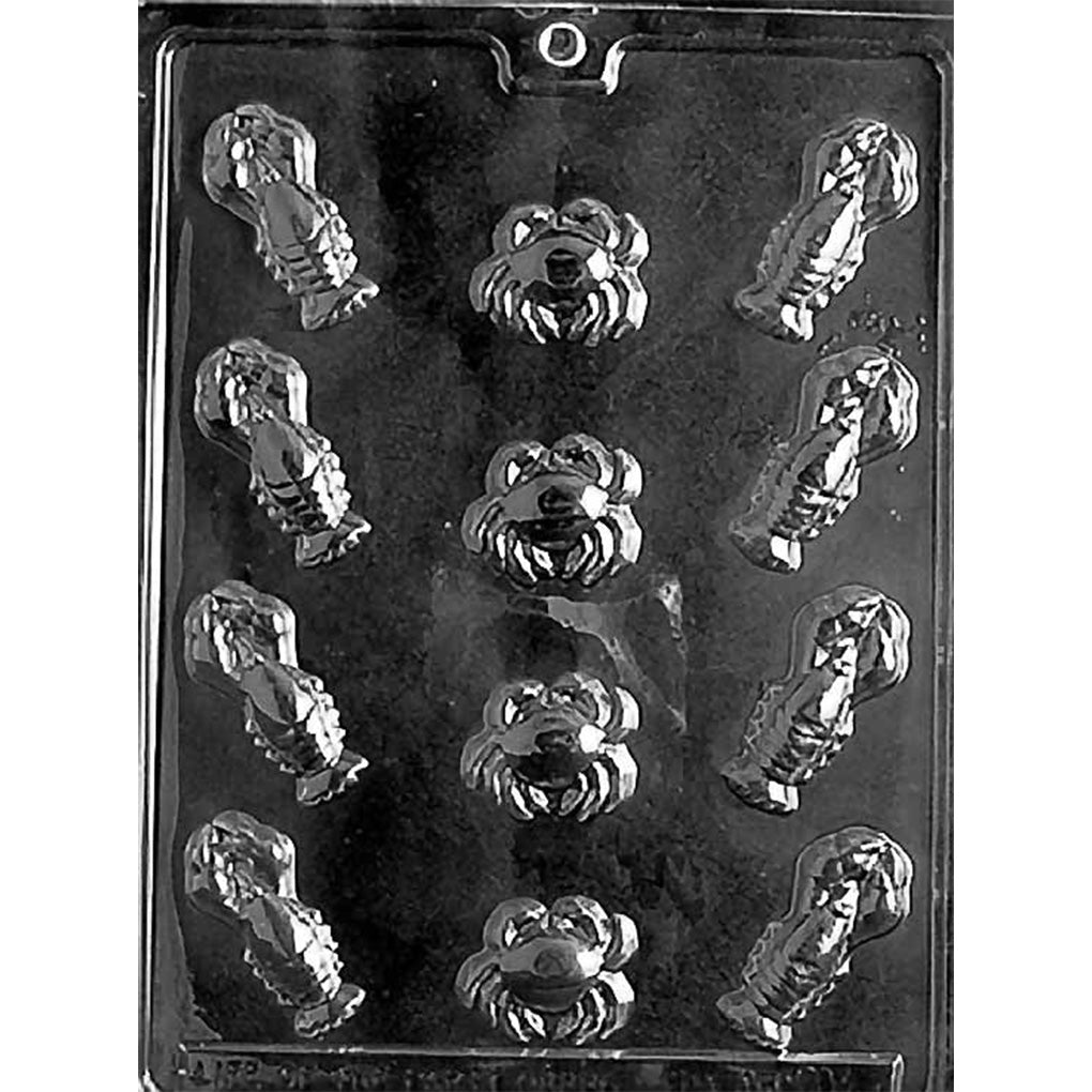 Clear plastic chocolate mold with multiple small lobster cavities along the sides and four crab-shaped cavities in the center, arranged in rows.
