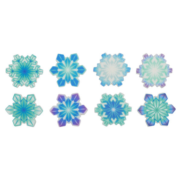 Assorted pressed sugar snowflake decorations in blue, teal, and purple designs.