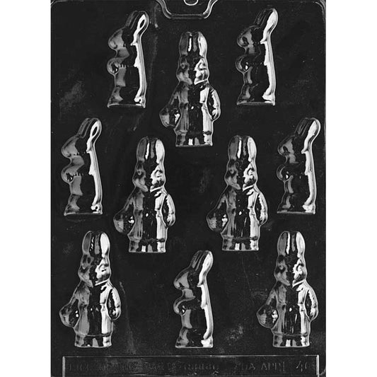 Clear plastic chocolate mold with assorted standing bunny cavities in different poses, including side-profile rabbits and front-facing bunnies with upright ears, on a dark background.