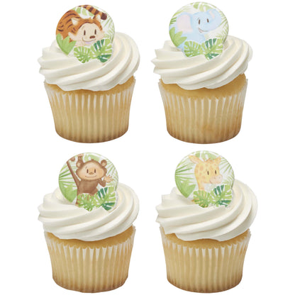 Four vanilla cupcakes with white frosting topped with assorted baby tiger, elephant, monkey, and giraffe cupcake rings