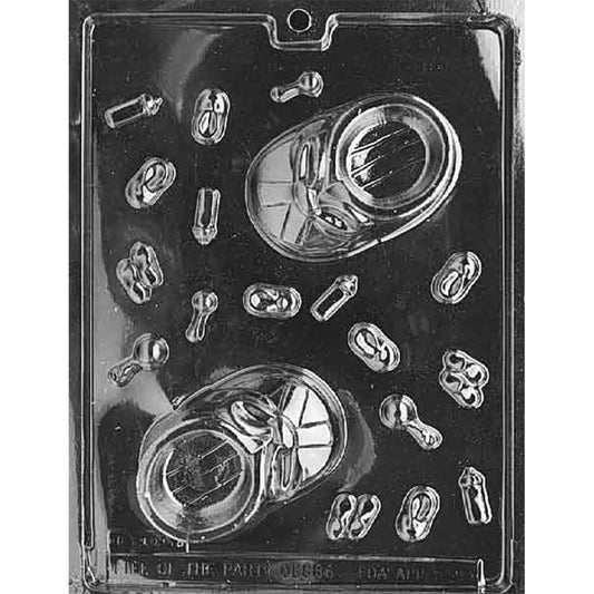 Clear plastic chocolate pour mold with two large baby bootie cavities featuring lace and shoe details, surrounded by small cavities shaped like baby bottles, tiny booties, and rattles.