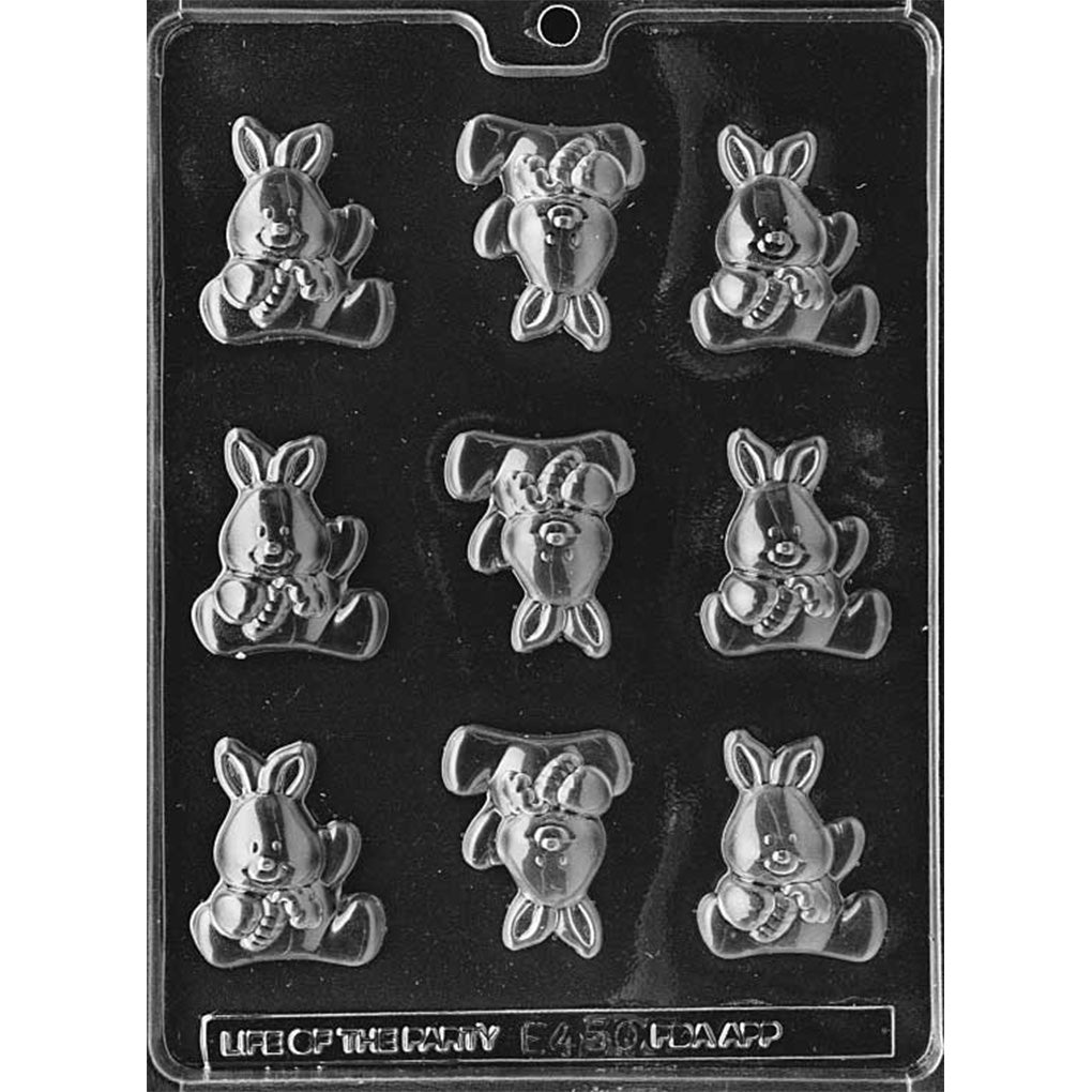 Clear Baby Bunny with Carrot Chocolate Mold photographed against a black background with 9 seated bunny cavities featuring long ears and carrots held in their paws.
