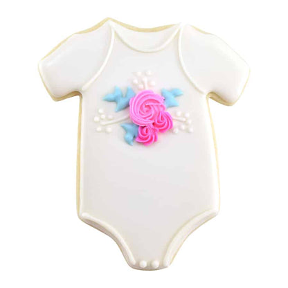 White baby onesie cookie decorated with delicate pink roses and blue leaf accents.