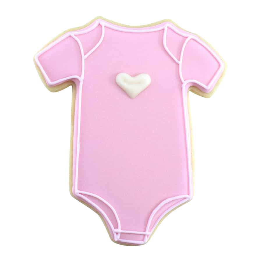 Pink baby onesie cookie decorated with a white heart and piped icing details.