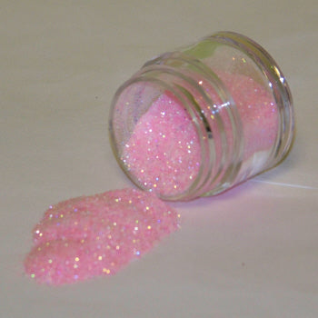 Soft pastel baby pink Galaxy Glitter Dust flowing from a jar, creating a luminous, sugary-looking pile with iridescent highlights