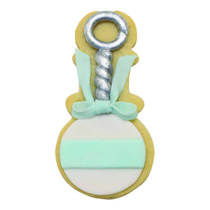 Decorated baby rattle cookie with pastel accents, silver detailing, and a fondant bow.