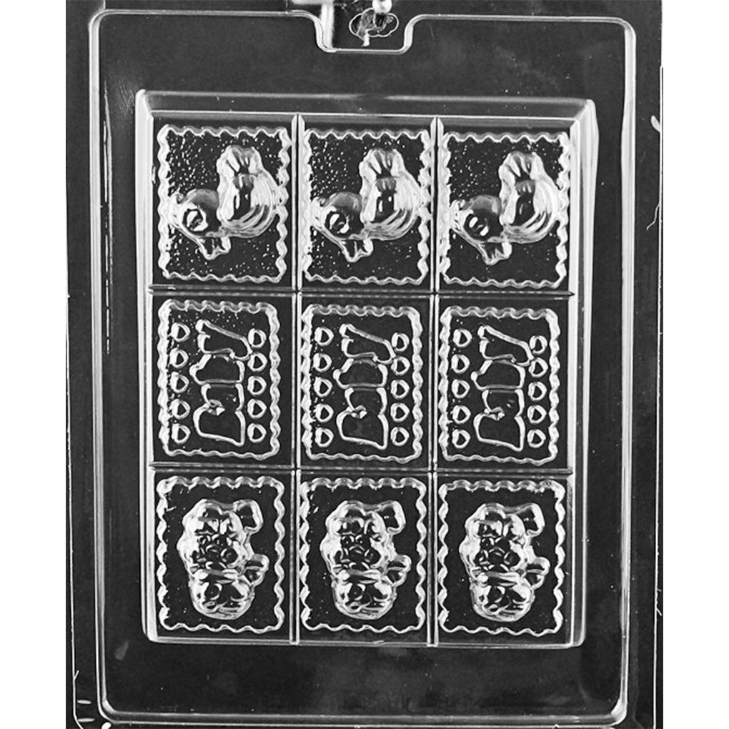 Break-apart baby theme chocolate bar mold with nine scalloped rectangles featuring three repeating designs: rubber ducky, “Baby” lettering, and a baby sheep.