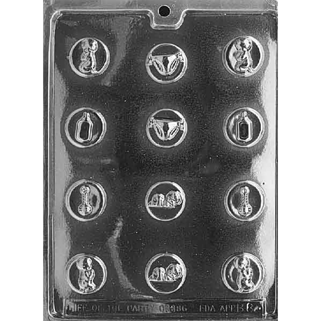 Clear plastic chocolate mold with small round cavities in a grid, each featuring raised baby-themed designs like a baby bottle, diaper, rattle, sleeping baby, and a teddy bear on a dark background.