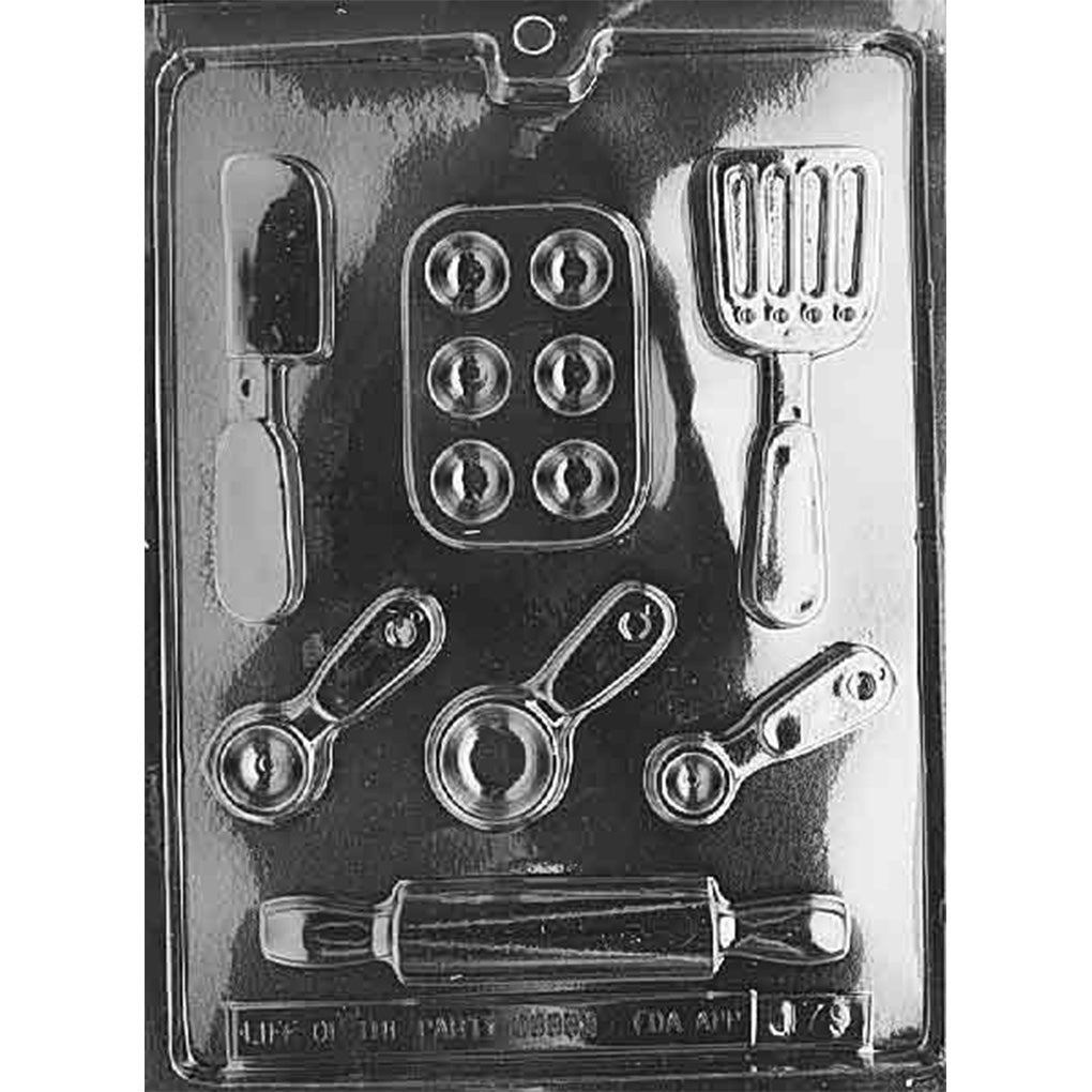 Baking set chocolate mold with seven cavities including a rolling pin, two spatulas, six-cup muffin pan, and three measuring tools