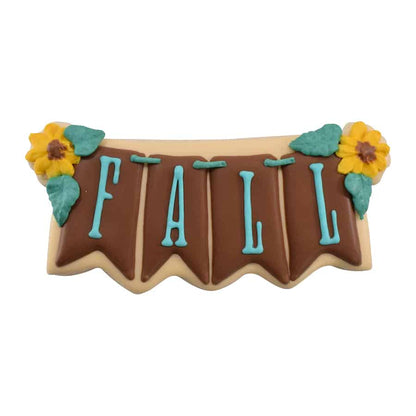 Decorated "FALL" banner cookie with brown icing, sunflowers, and blue lettering.