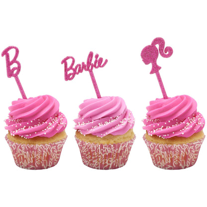Pink glitter Barbie “B,” Barbie script, and ponytail silhouette DecoPics® displayed on three pink-frosted cupcakes