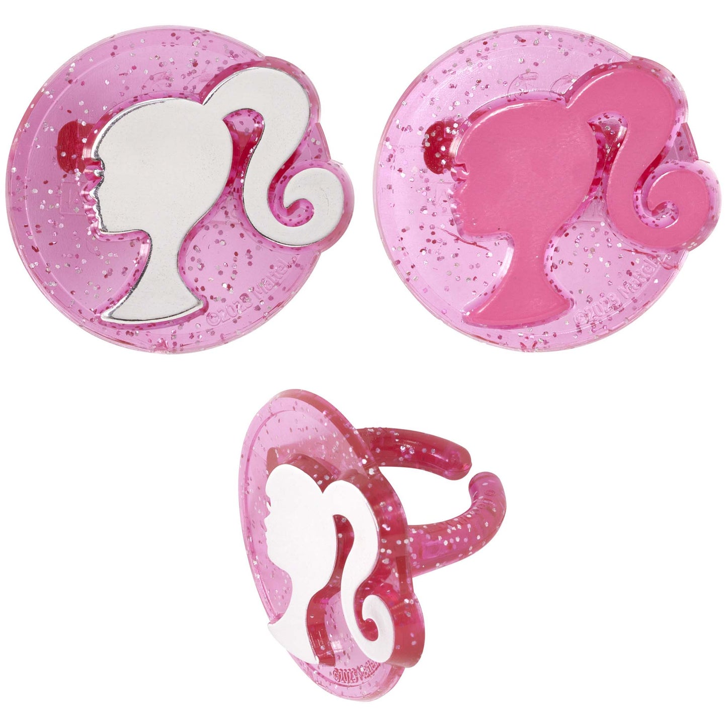 Two glittery pink Barbie silhouette cupcake rings shown front and back with a side view of the ring band.