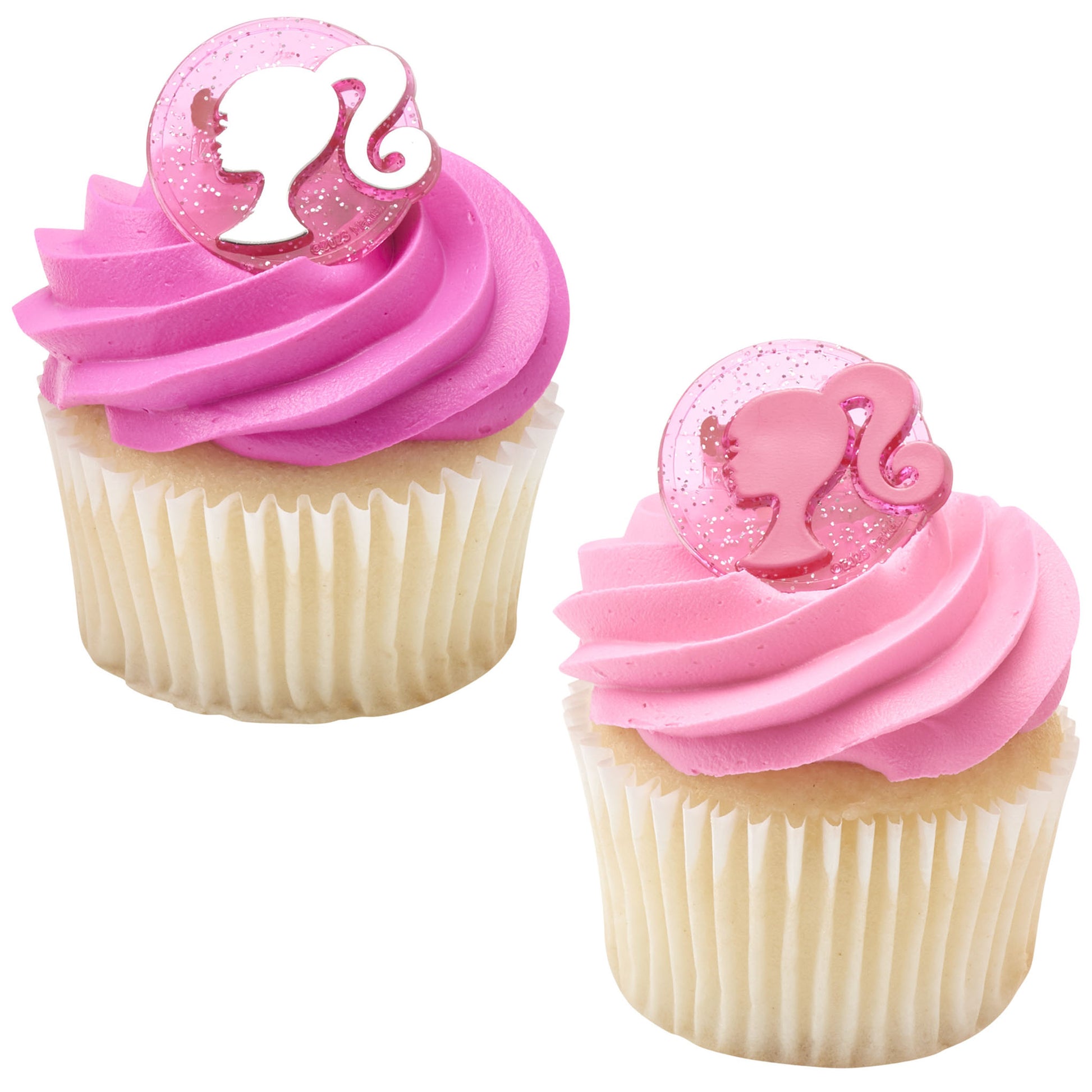 Two cupcakes topped with glittery pink Barbie silhouette rings set into pink frosting swirls.