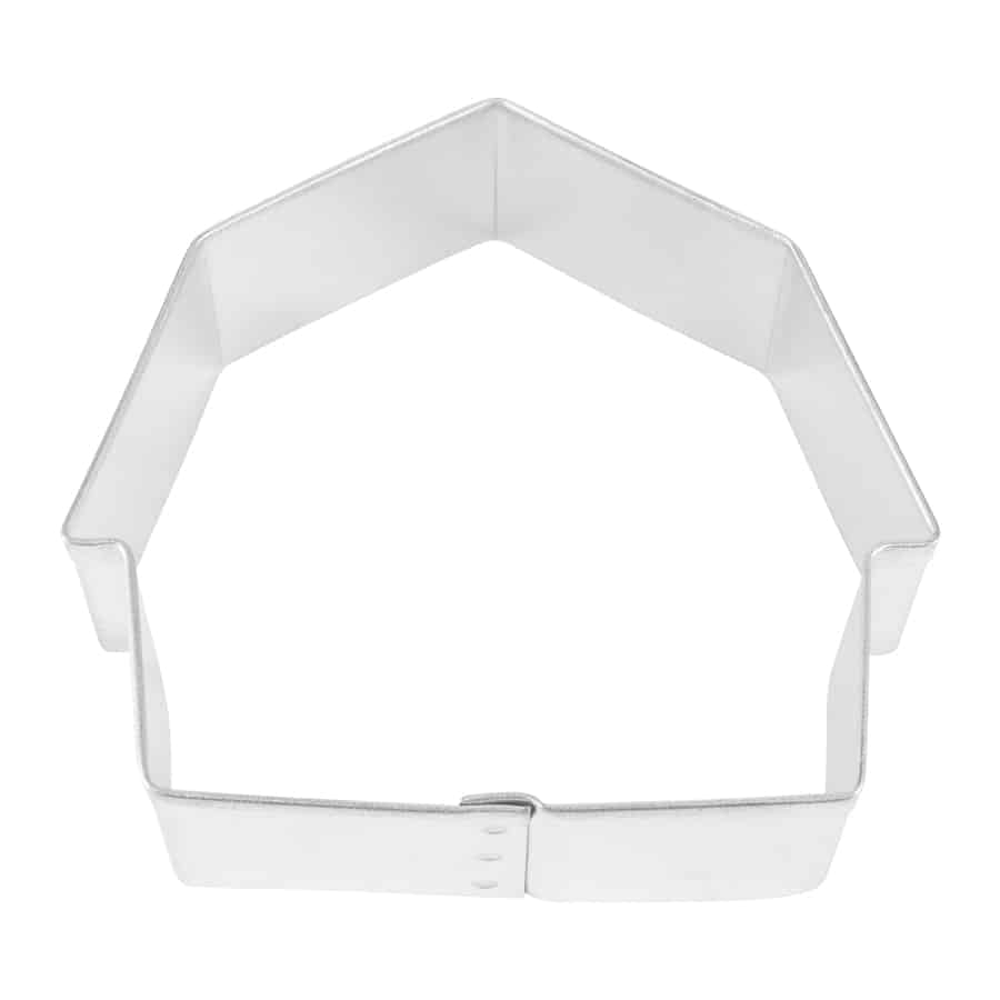 Metal barn-shaped cookie cutter with a peaked roof and straight sides, photographed from a top-down view on a white background.