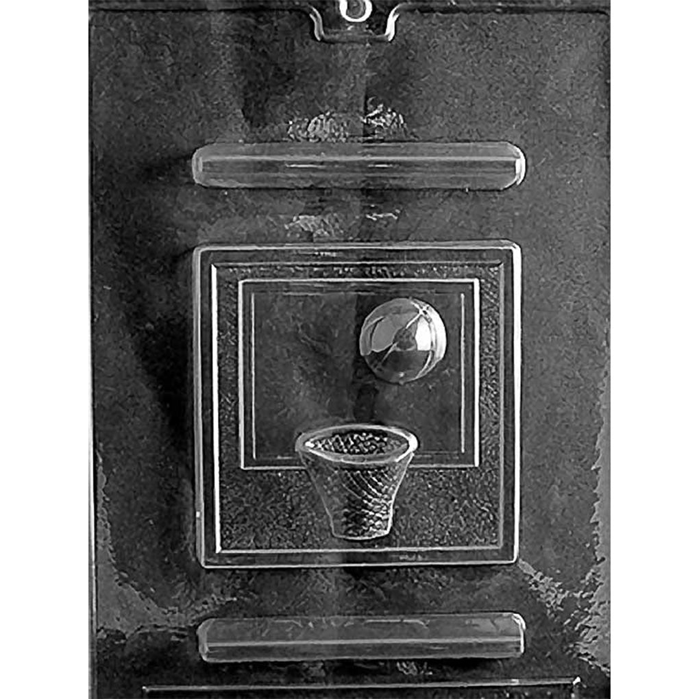 Clear Basketball Hoop & Backboard Chocolate Mold photographed against a black background with a square backboard, textured hoop and net, and basketball shown above the basket.