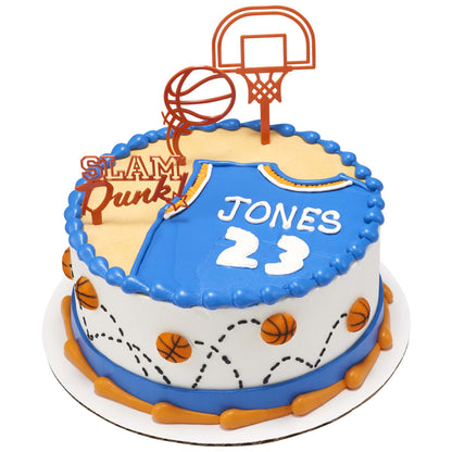 Basketball-themed cake topped with orange plastic basketball hoop and ball picks, plus a small pressed sugar basketball decoration shown separately.