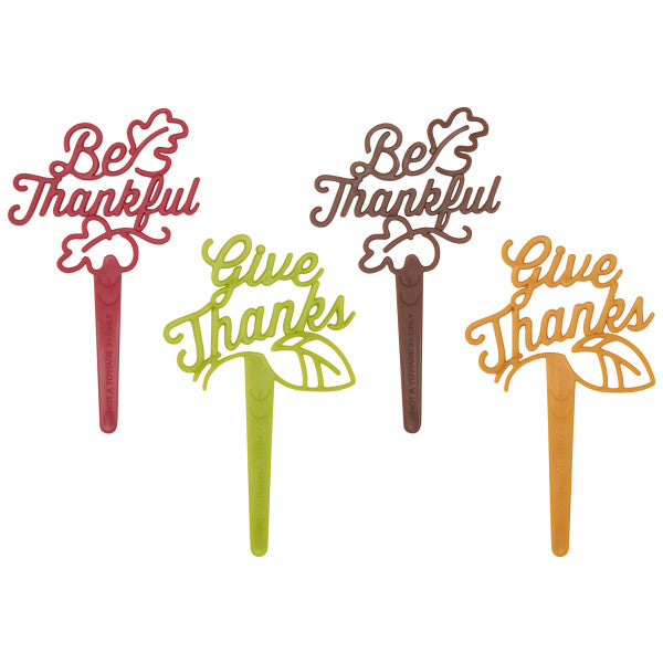 Set of four fall-themed Thanksgiving picks reading “Be Thankful” and “Give Thanks” in red, brown, orange, and green.