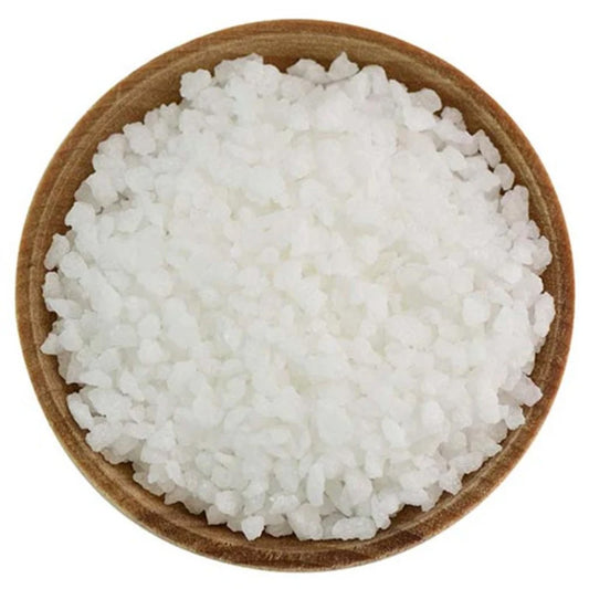 Large white Belgian pearl sugar crystals piled in a clear glass bowl