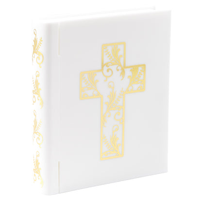 Closed white Bible cake topper with a decorative gold cross on the cover and coordinating gold details along the spine.