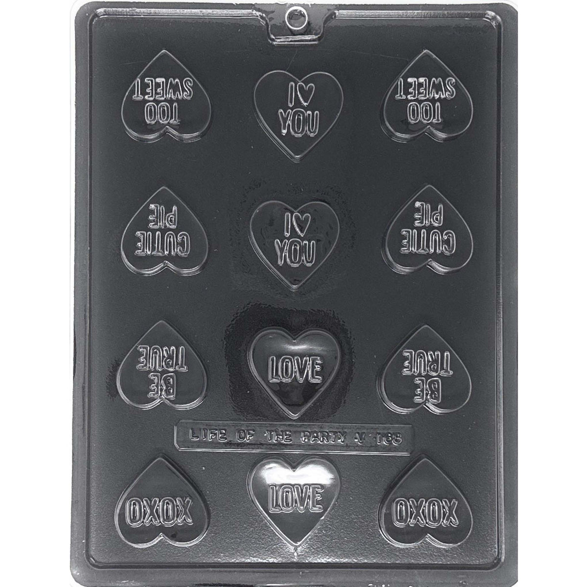 Clear Bite Size Heart Sayings Chocolate Mold photographed against a black background, showing 12 heart-shaped cavities with raised romantic sayings including I Love You, Love, Too Sweet, Cutie Pie, Be True, and XOXO.