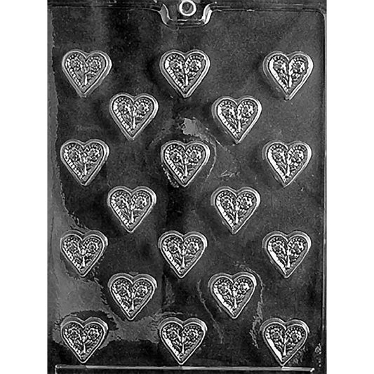 Clear Bite-Sized Heart With Flowers Chocolate Mold photographed against a black background with 18 small heart-shaped cavities featuring paired floral designs.