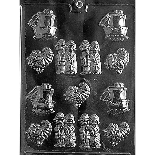 Clear Bite Size Thanksgiving Assortment Chocolate Mold photographed against a black background with 13 cavities featuring Mayflower ships, pilgrim couples, and cornucopias.