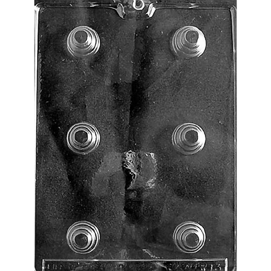 Clear plastic chocolate mold with six bite-sized round cavities shaped like small three-tier cakes.