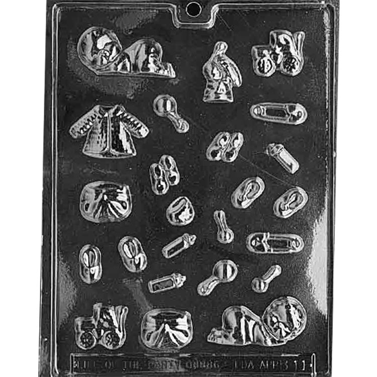Clear plastic chocolate mold filled with many tiny baby-themed cavities, including a sleeping baby, stork carrying a bundle, stroller, baby shoes, diapers, safety pins, and small accessory shapes, on a dark background.
