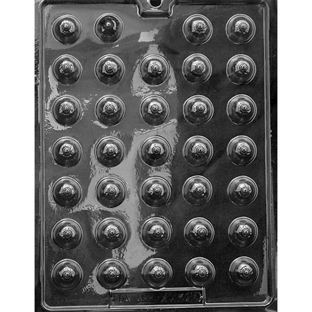 Clear plastic chocolate mold photographed against a dark background, featuring 34 small round breast-shaped cavities with raised nipple details arranged in rows.