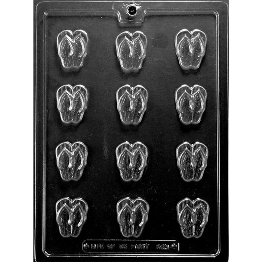 Clear Bite Size Flip Flops Chocolate Mold photographed against a black background with 12 small sandal-shaped cavities featuring raised flip flop straps and sole details.