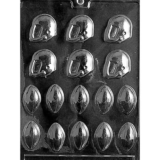 Clear plastic chocolate mold tray showing assorted bite-size football and football helmet cavities with raised details, arranged in rows on a dark background.