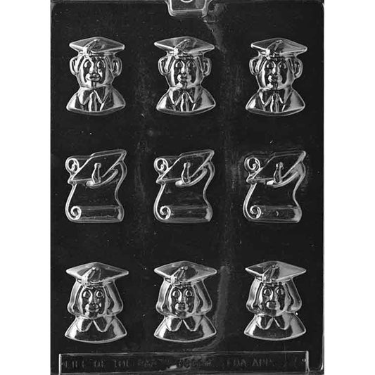 Clear plastic chocolate mold with nine bite-size cavities: male and female graduate faces wearing mortarboards and three rolled diploma shapes, arranged in rows on a dark background.