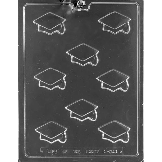Clear plastic chocolate mold with eight small graduation cap cavities arranged in a grid, each showing a mortarboard shape with a tassel detail, on a dark background.