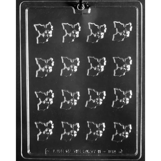 Clear plastic chocolate mold tray with sixteen small holly leaf cavities, each with a raised berry cluster.