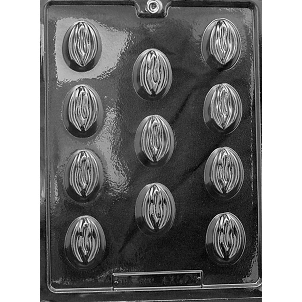 Black plastic chocolate mold with 11 small oval cavities featuring detailed vulva shapes arranged across the rectangular mold tray.