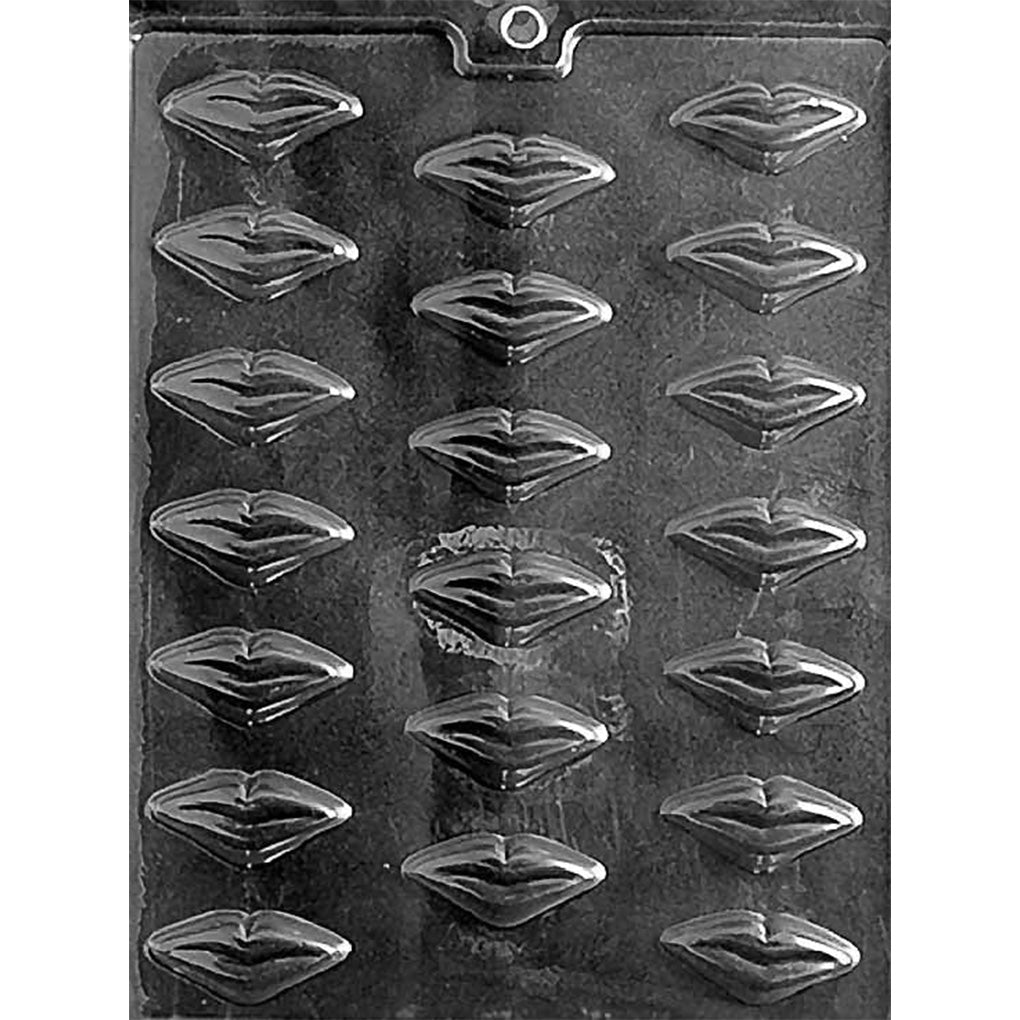 Clear chocolate mold with 20 small puckered lip-shaped cavities arranged in rows on a dark background.