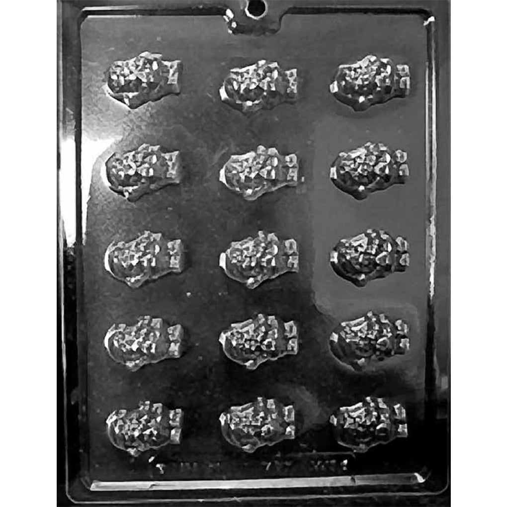 Clear plastic chocolate mold photographed on a black background with multiple small cavities shaped like Santa holding a candy cane, featuring textured hat and coat details.
