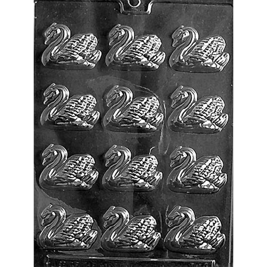 Clear plastic chocolate mold photographed on a black background with rows of small swan-shaped cavities, showing curved necks and textured feather wings.
