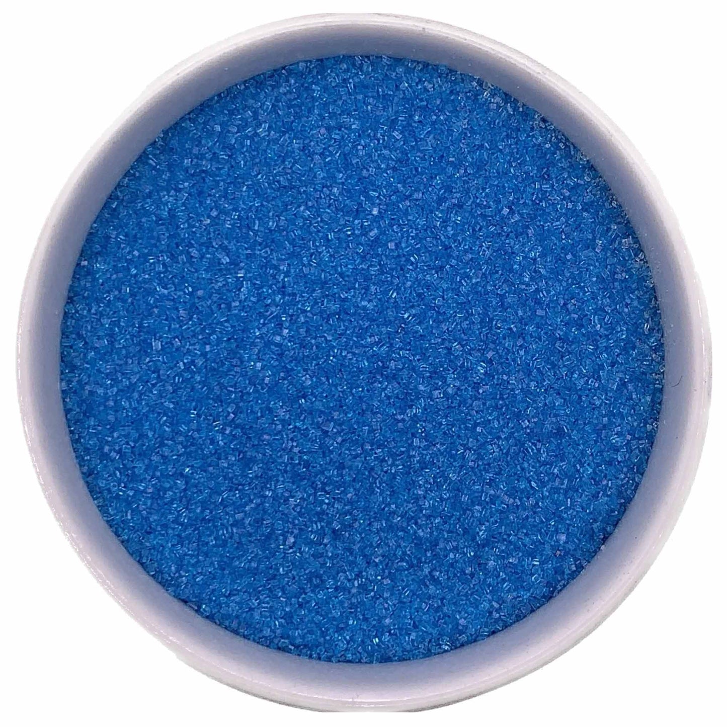 Bowl of bright blue fine sanding sugar crystals on a white background.