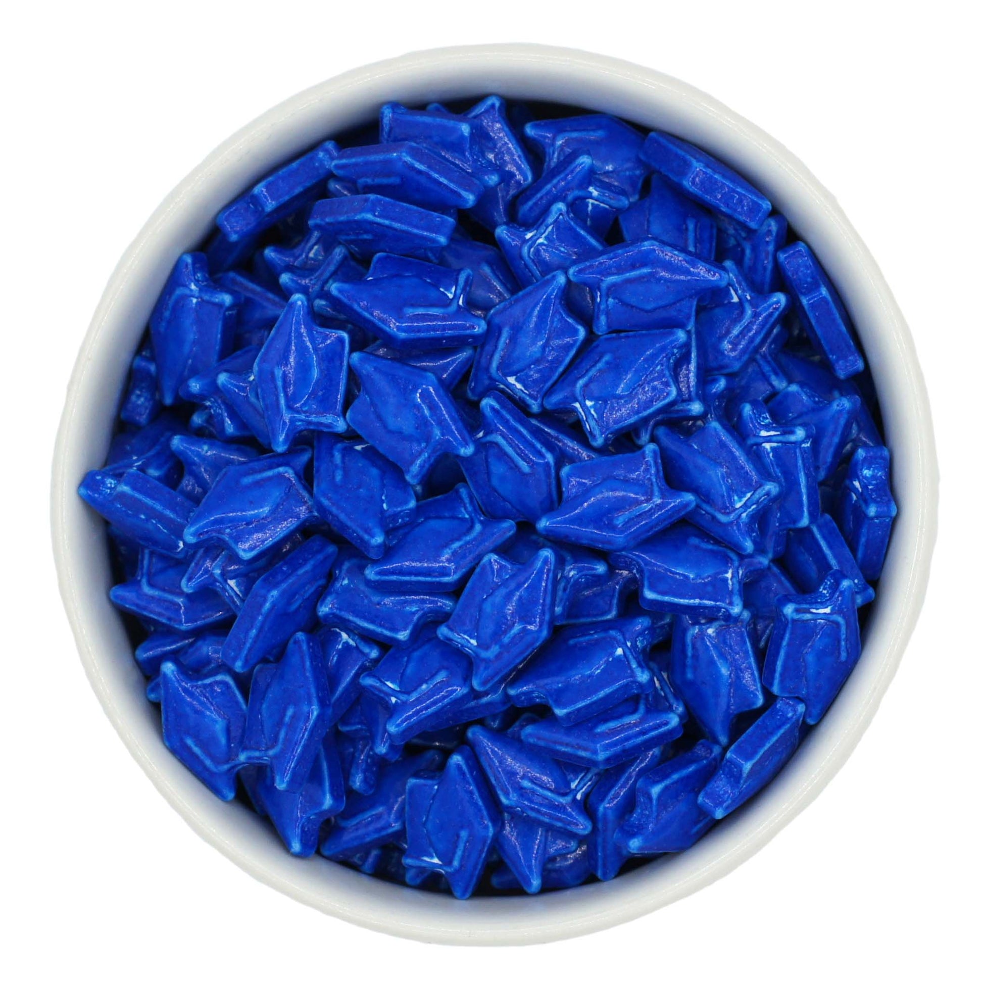 White bowl filled with blue Graduation Hat Tart Candy Sprinkles on a white background 