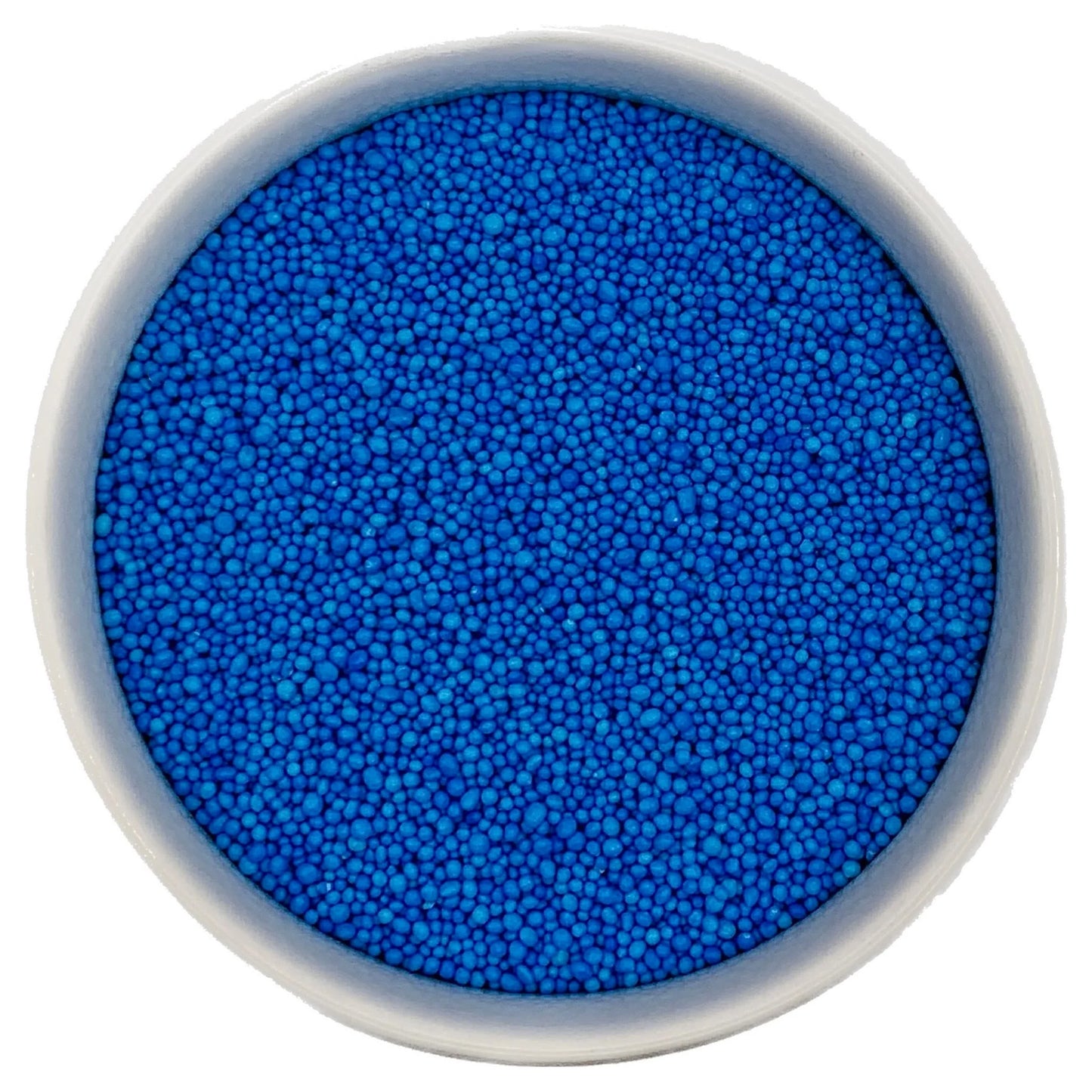 Top-down view of a white bowl filled with blue non-pareils, showing tiny round sprinkle beads in a vivid bright blue shade.