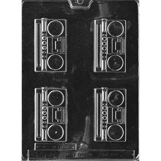 Clear plastic chocolate mold with four retro boombox cavities, each showing two round speaker circles, a central rectangular panel, and small button details along the side.