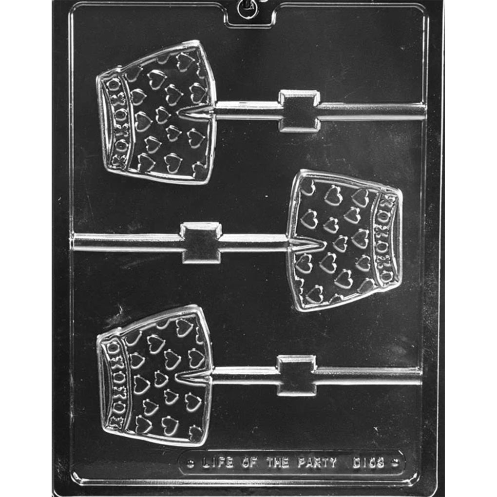 Clear chocolate lollipop mold with three boxer shorts-shaped cavities, each decorated with a heart pattern and a raised XOXO waistband, shown on a dark background.