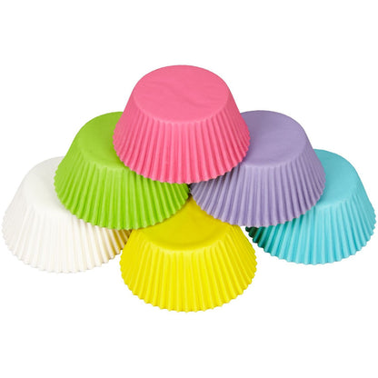 Stack of pastel-colored cupcake liners in pink, purple, yellow, green, white, and blue.