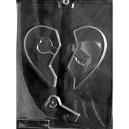Clear chocolate mold with two broken heart half cavities and one small key-shaped cavity.
