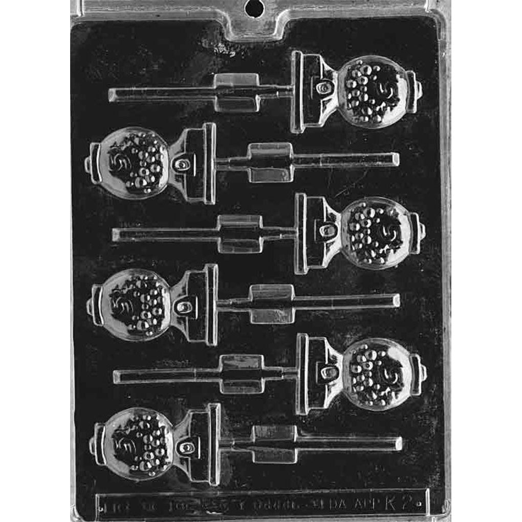 Six-cavity bubblegum machine chocolate lollipop mold with round candy-filled globes, coin knobs, bases, and built-in stick channels