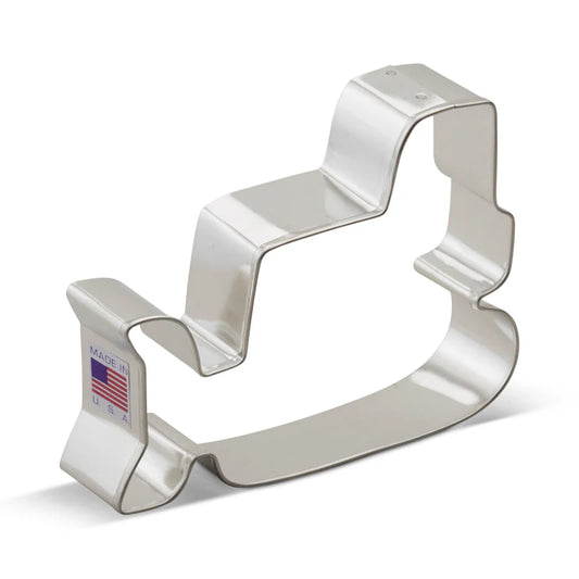 Metal bulldozer-shaped cookie cutter with a Made in USA label, displayed against a white background.